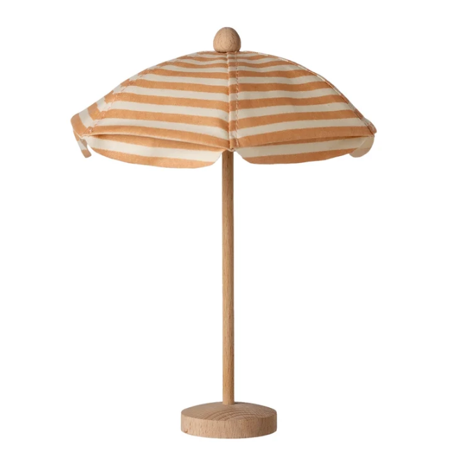 A small table umbrella with a natural wood pole and base, featuring a canopy with horizontal beige and white stripes.