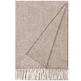 Beige woven blanket with white fringe on a plain background