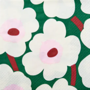 Floral patterned napkin with white flowers on a green background