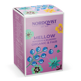 Nordvist Mellow Rooibos & Bilberry Organic & Fair tea box, featuring a light pink and purple design with blue berries and colorful floral illustrations.