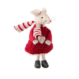 Toy mouse in a red dress and striped scarf on a white background