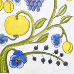 Decorative illustration of yellow fruits, blue flowers, and green leaves on a white background