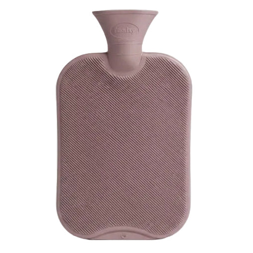 Pink hot water bottle on a light gray background